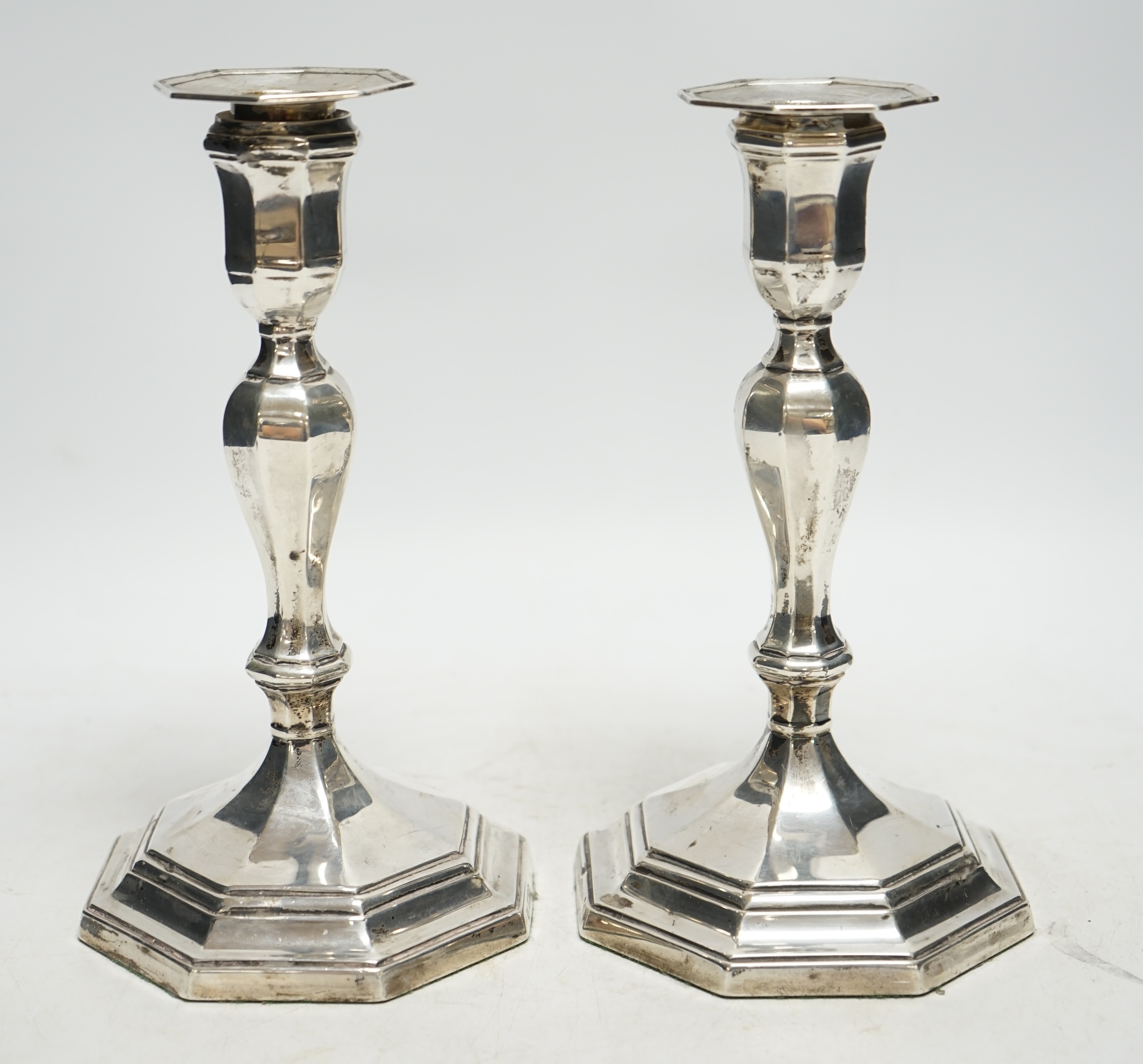 A pair of Edwardian silver octagonal candlesticks, Hawksworth, Eyre & Co Ltd, Sheffield, 1905, 21.7cm, weighted. Condition - average to fair